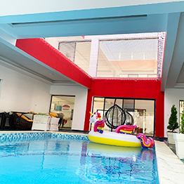 a large outdoor net over a swimming pool 