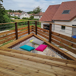 a wooden terrace with a custom net