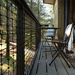 Rambarde en filet d'habitation sur terrasse en bois