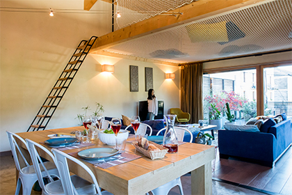 Holiday home with large catamaran net suspended over lounge